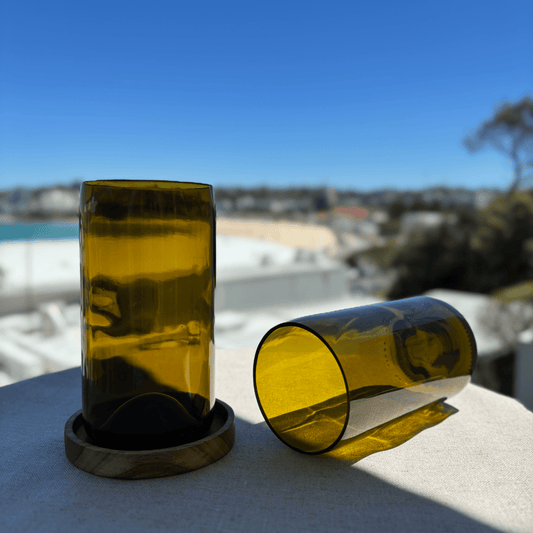 Image of two 600ml up-cycled glass tumblers in green colour, durable and dishwasher safe.