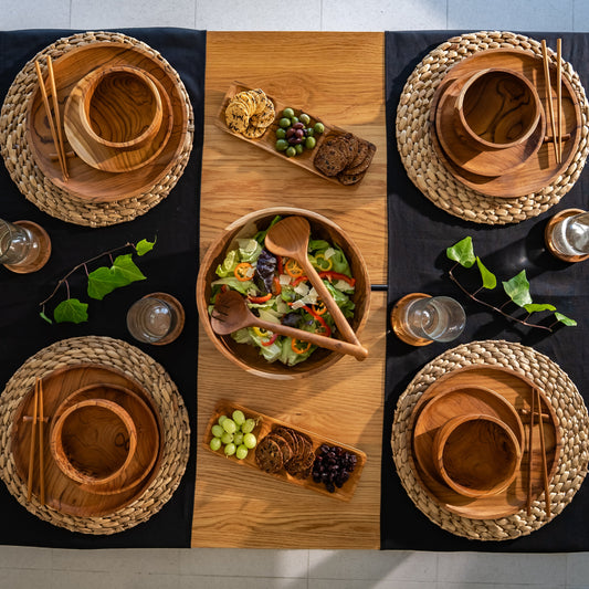 Images shows a stunning trio of handcrafted pieces, comprising a larger plate (28cm x 2cm), smaller plate (20cm x 1.5cm) and a bowl (14cm x 8cm). All pieces are handcrafted from sustainable teak and are as durable as they are stylish.