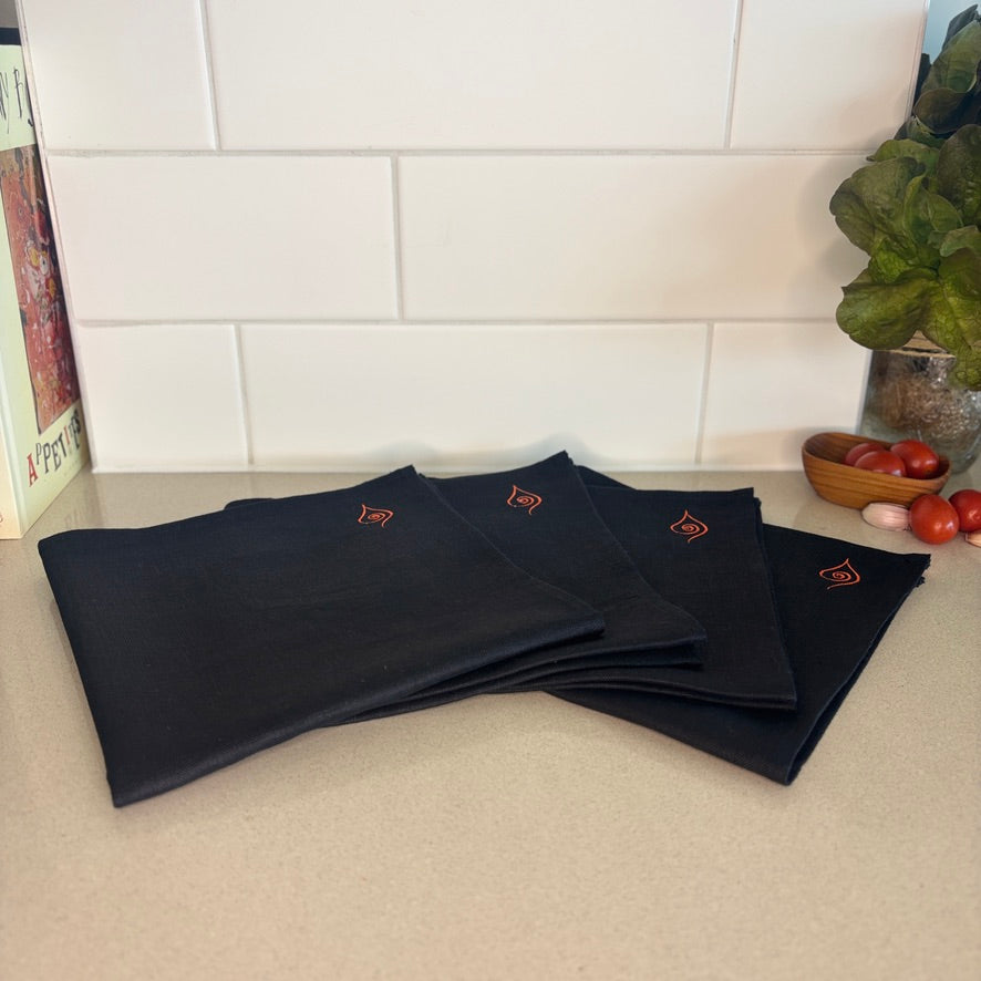 These hand-sown black napkins are lightweight, breathable and beautifully textured. Each napkin tells a story of thoughtful craftsmanship and sustainable living. Dimensions - 43cm x 43cm.