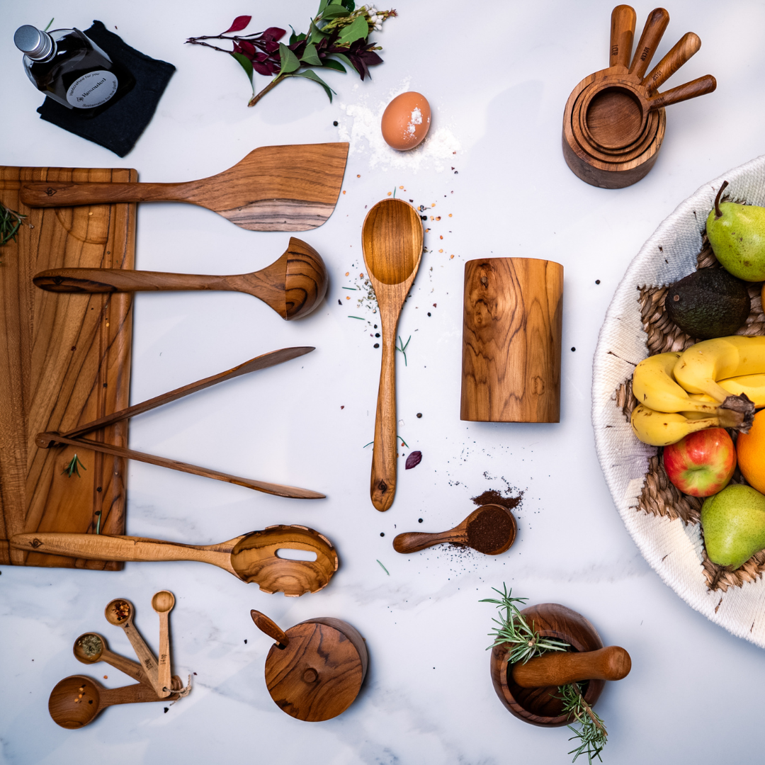 Sustainable Kitchen utensils inclusive of 6 piece utensil set, chopping board, rice spoon, measuring cups and spoons, salt keeper, mortal and pestle and water hyacinth fruit bowl 