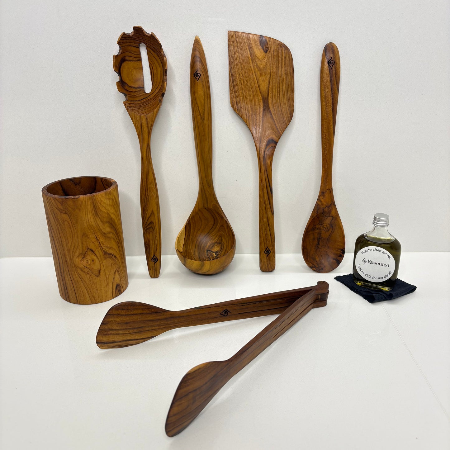 Kitchen Utensil Set is the perfect kitchen sidekick, bringing together Six beautifully crafted, high quality, sustainable teak tools for every culinary adventure. 
Spatula: 31.5cm x 8.5cm
Wooden Spoon: 30cm x 6cm x 2cm
Spaghetti Server: 31cm x 7cm x 4cm
Tongs: 22cm x 7cm x 3cm
Ladle: 31cm x 4cm x 10cm
Utensil Holder: 14cm x 9cm
FREE 50ml bottle of Hemp Oil