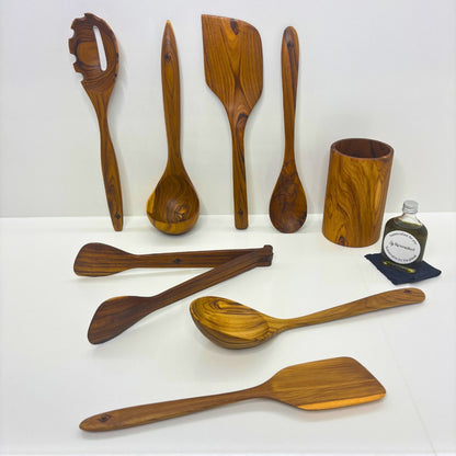 Kitchen Utensil Set is the perfect kitchen sidekick, bringing together Six beautifully crafted, high quality, sustainable teak tools for every culinary adventure. 
Spatula: 31.5cm x 8.5cm
Wooden Spoon: 30cm x 6cm x 2cm
Spaghetti Server: 31cm x 7cm x 4cm
Tongs: 22cm x 7cm x 3cm
Ladle: 31cm x 4cm x 10cm
Utensil Holder: 14cm x 9cm
FREE 50ml bottle of Hemp Oil
Turner: 29.5cm x 6cm x 8cm
Serving Spoon: 30cm x 8cm x 3.5cm