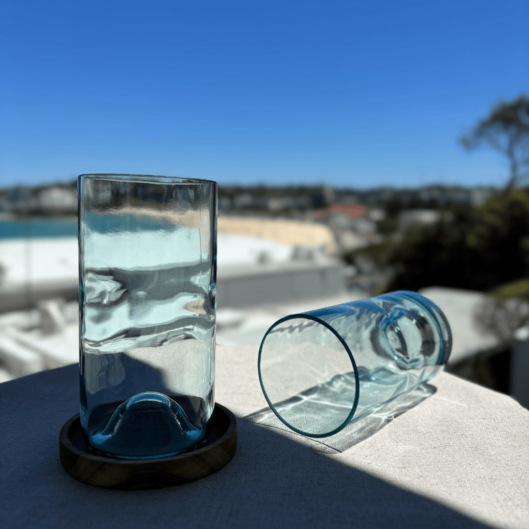 Image of two 550ml up-cycled glass tumblers in clear blue colour, durable and dishwasher safe.