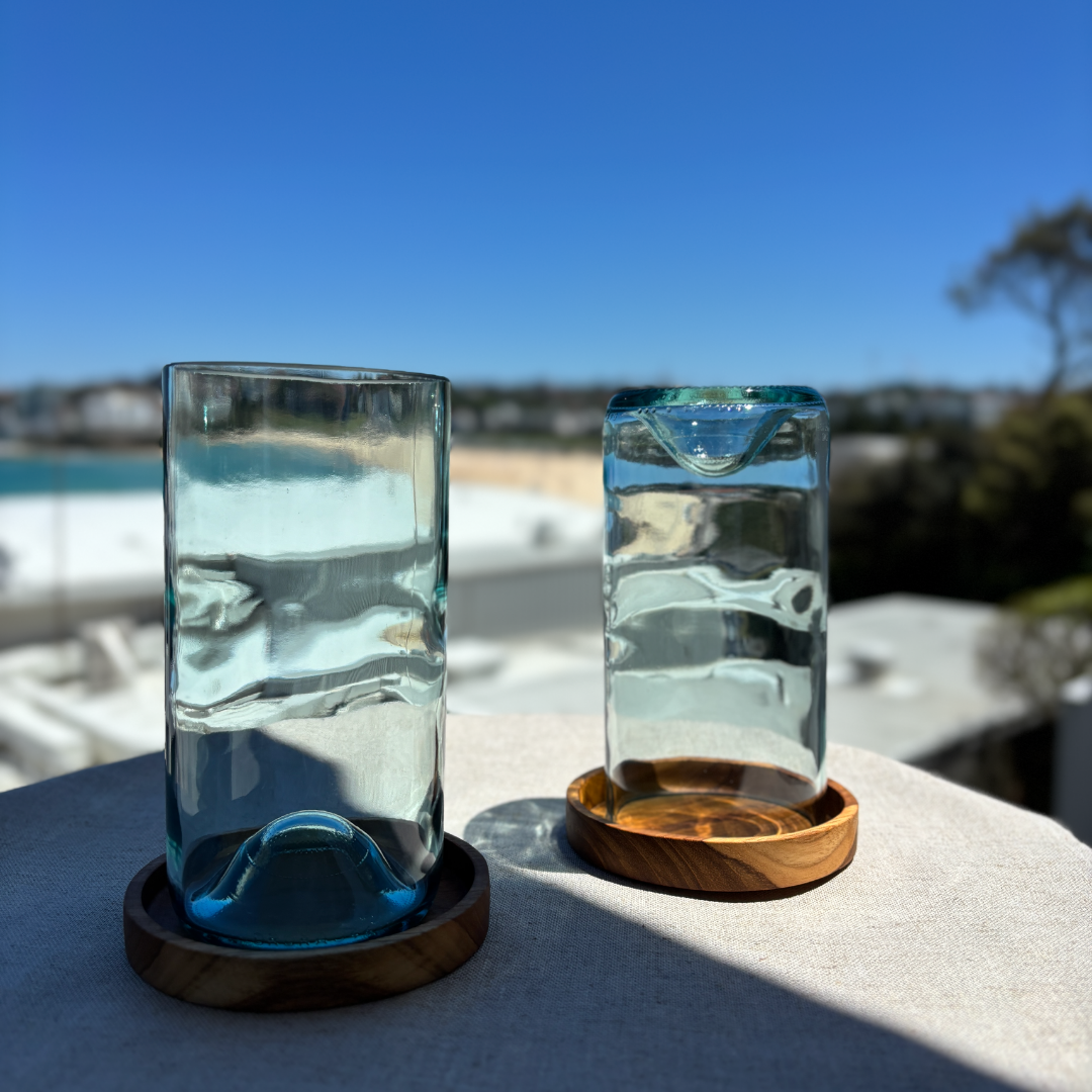 Image of two 550ml up-cycled glass tumblers in clear blue colour, durable and dishwasher safe.