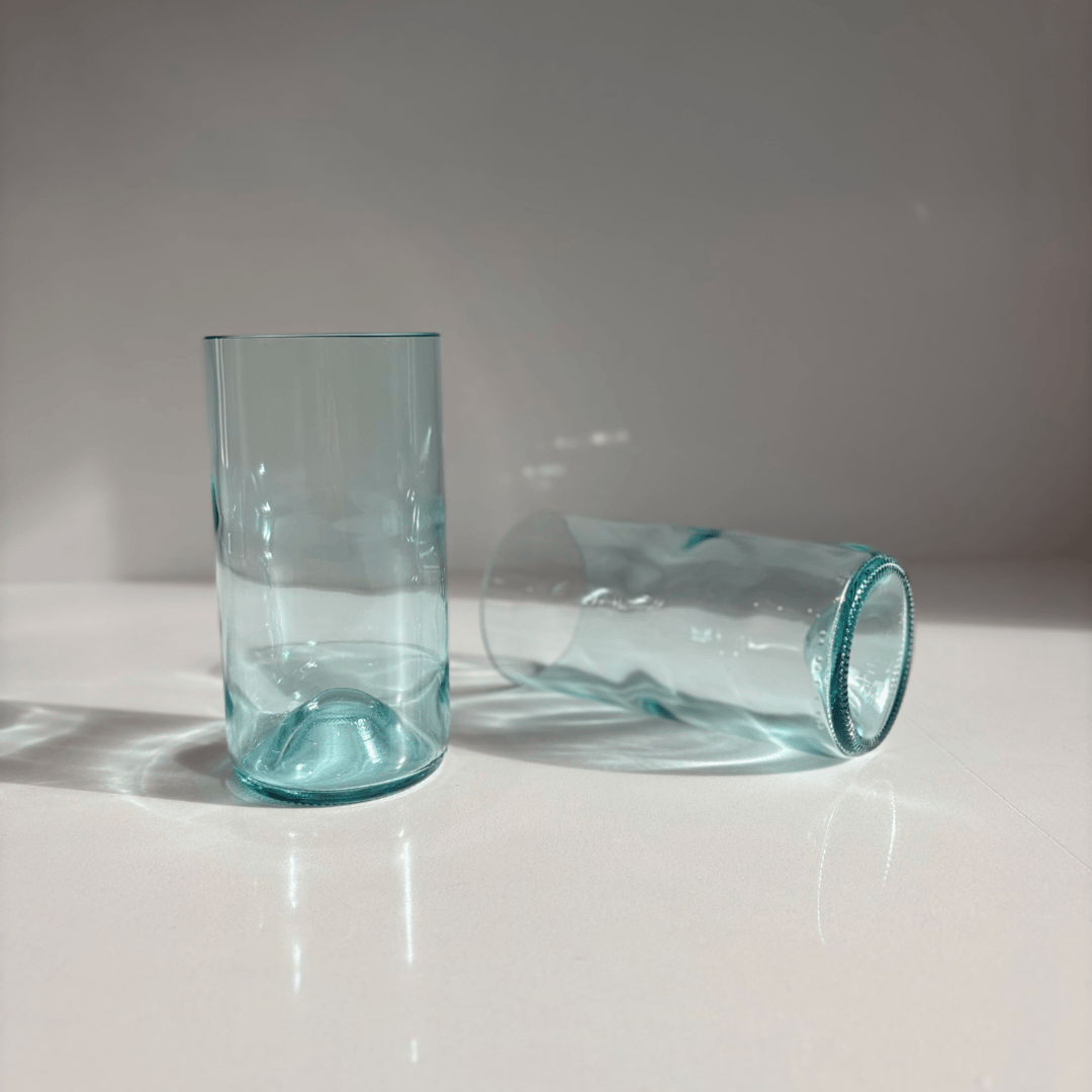 Image of two 550ml up-cycled glass tumblers in clear blue colour, durable and dishwasher safe.