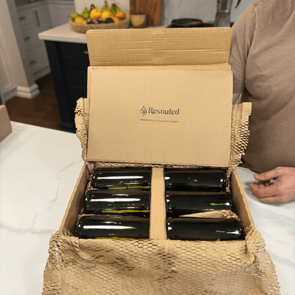 Image of two 600ml up-cycled glass tumblers in green colour, durable and dishwasher safe. Sustainable packaging 
