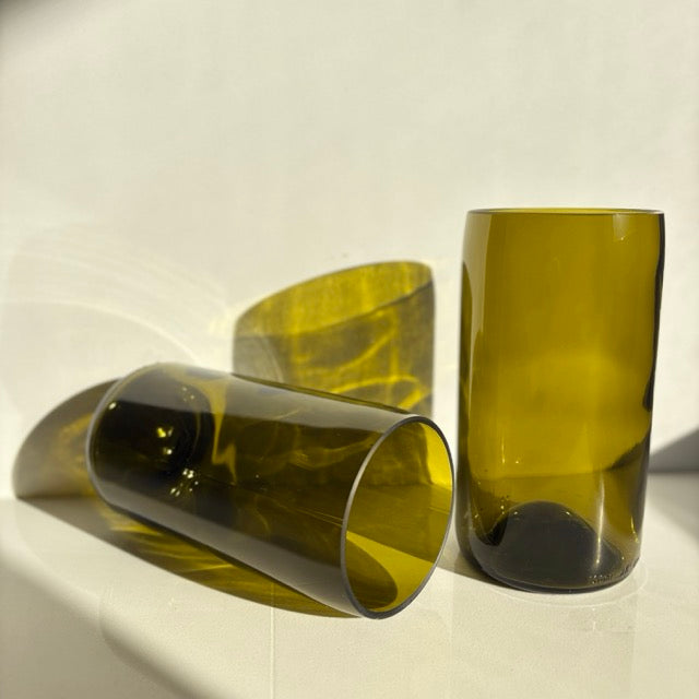 Image of two 600ml up-cycled glass tumblers in green colour, durable and dishwasher safe.