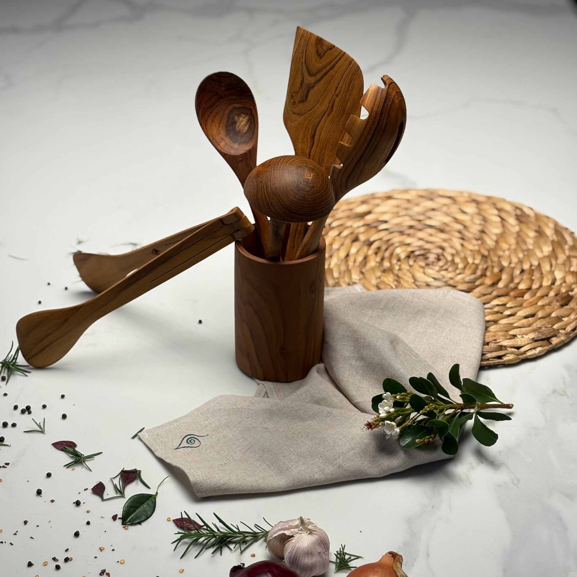 Kitchen Utensil Set is the perfect kitchen sidekick, bringing together five beautifully crafted, high quality, sustainable teak tools for every culinary adventure. 
Spatula: 31.5cm x 8.5cm
Wooden Spoon: 30cm x 6cm x 2cm
Spaghetti Server: 31cm x 7cm x 4cm
Tongs: 22cm x 7cm x 3cm
Ladle: 31cm x 4cm x 10cm
Utensil Holder: 14cm x 9cm