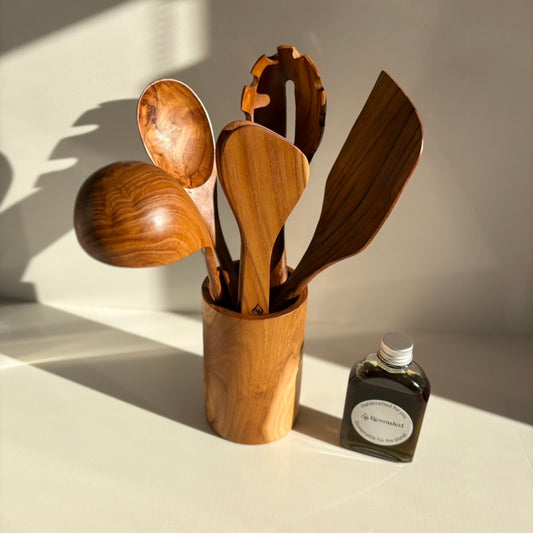 Kitchen Utensil Set is the perfect kitchen sidekick, bringing together five beautifully crafted, high quality, sustainable teak tools for every culinary adventure. 
Spatula: 31.5cm x 8.5cm
Wooden Spoon: 30cm x 6cm x 2cm
Spaghetti Server: 31cm x 7cm x 4cm
Tongs: 22cm x 7cm x 3cm
Ladle: 31cm x 4cm x 10cm
Utensil Holder: 14cm x 9cm
FREE 100ml bottle of Hemp Oil