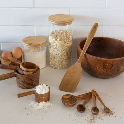 Handcrafted single-piece teak wooden measuring cups stacked on a marble bench with measuring spoons, mixing bowl and turner. 
1 Cup (250ml)
1/2 Cup (125ml)
1/3 Cup (80ml)
1/4 Cup (62.5ml)