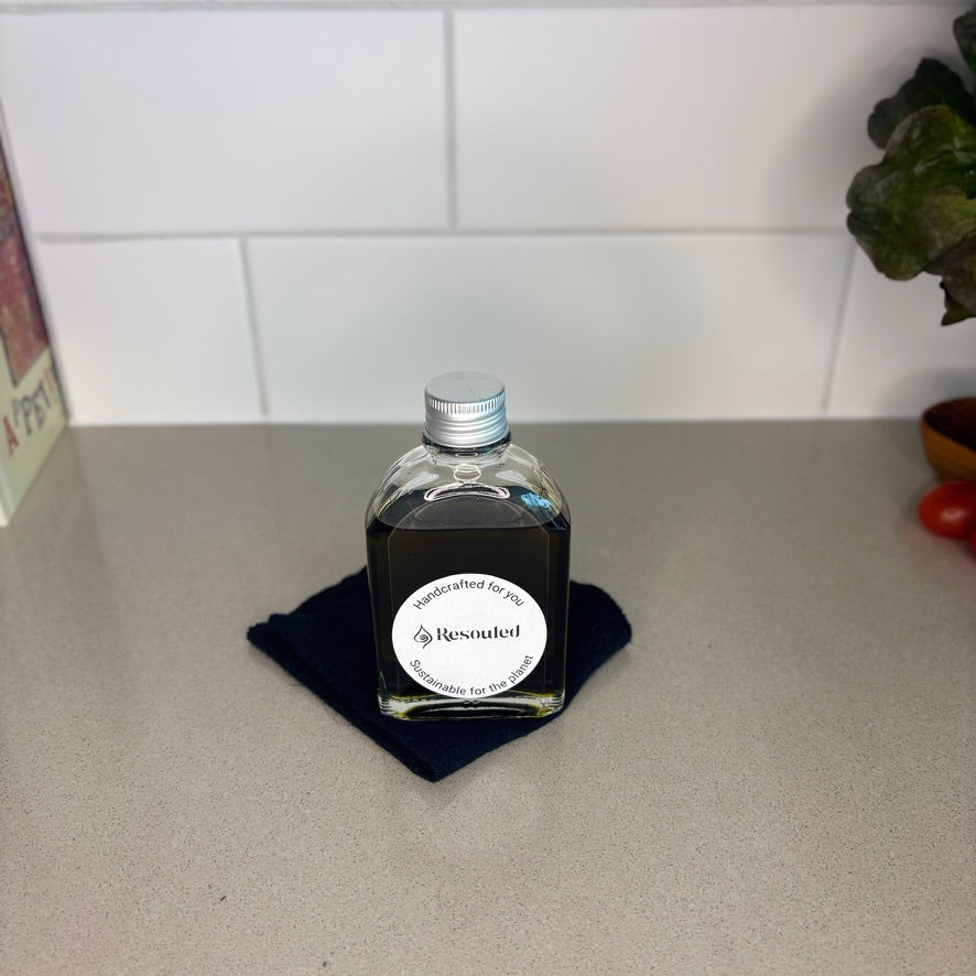 100ml bottle of 100% natural, food safe hemp seed oil in recyclable glass packaging with hemp cloth for application 