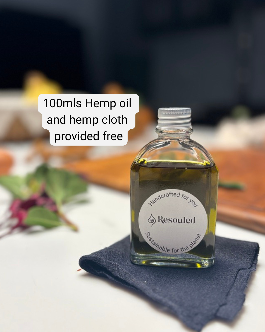 100ml bottle of 100% natural, food safe hemp seed oil in recyclable glass packaging with hemp cloth for application