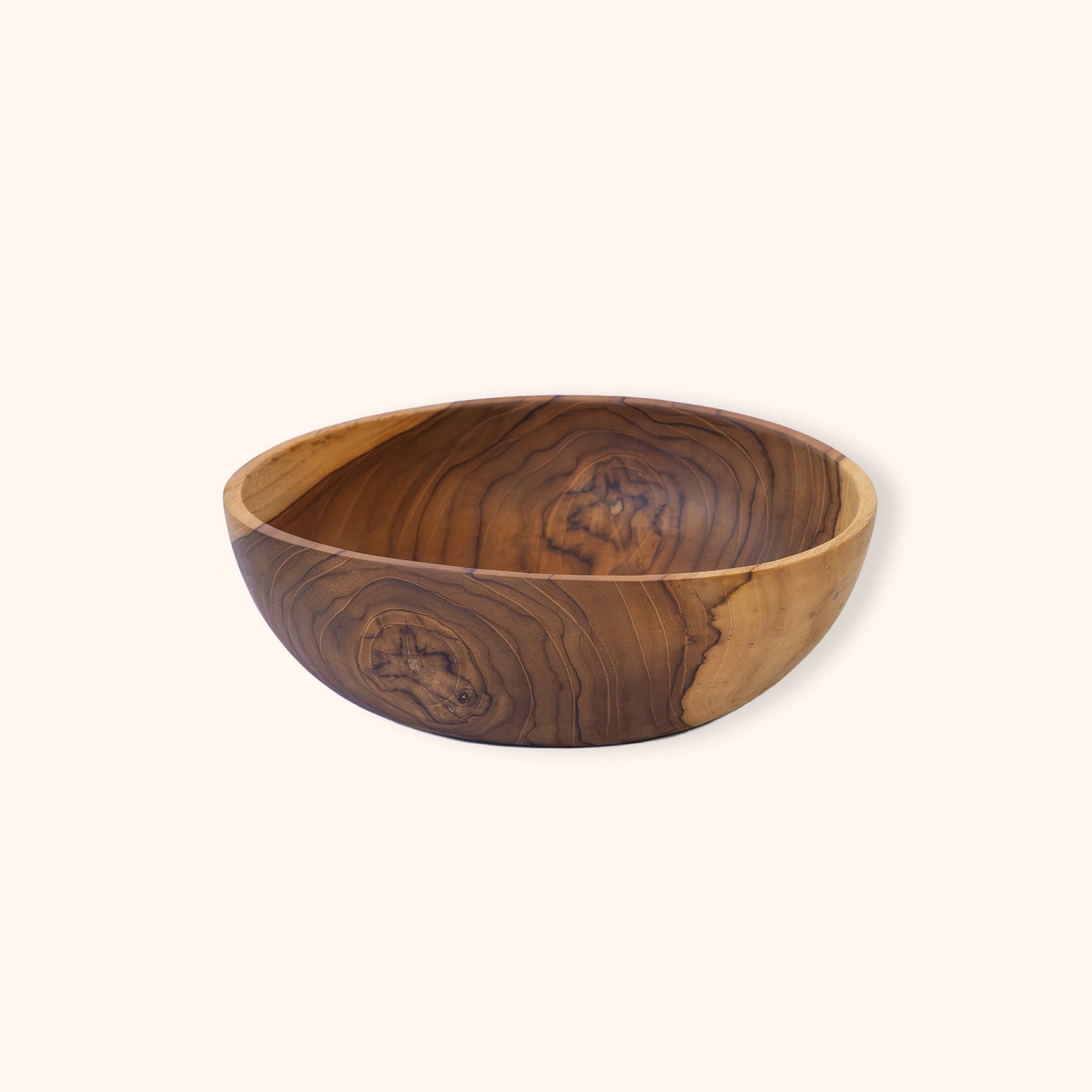 Single piece teak salad serving bowl on a clear background
