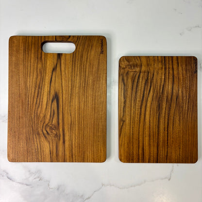 Image showing set of 2 teak chopping boards showing vs competitor wood fibre board, highlighting plastic-free materials, knife-friendliness, and natural sustainability.
