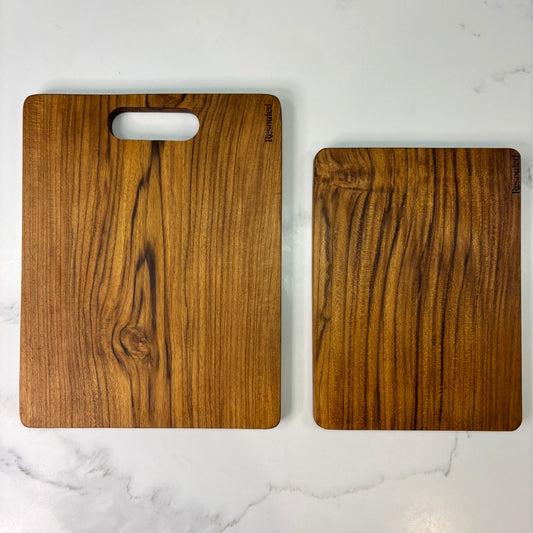 Image showing set of 2 teak chopping boards showing vs competitor wood fibre board, highlighting plastic-free materials, knife-friendliness, and natural sustainability.