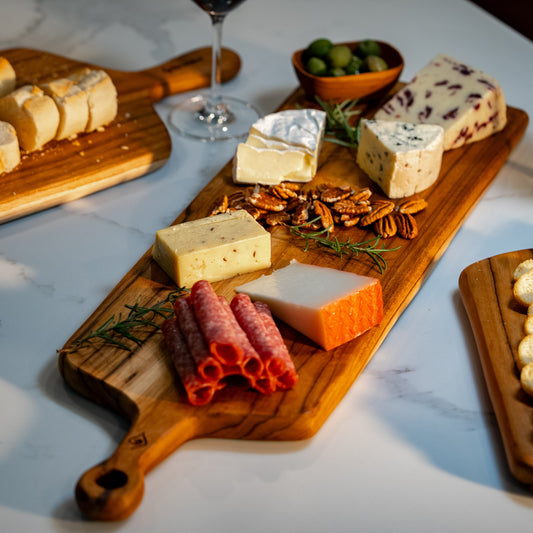 This durable sleek teak charcuterie board is a masterpiece and is designed for serving bold, adventurous spreads. 
60cm x 18cm x 1.5cm