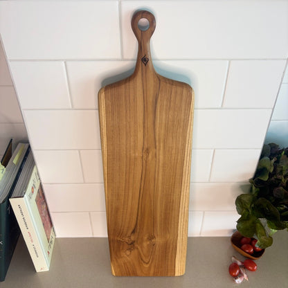 This durable sleek teak charcuterie board is a masterpiece and is designed for serving bold, adventurous spreads. 
60cm x 18cm x 1.5cm