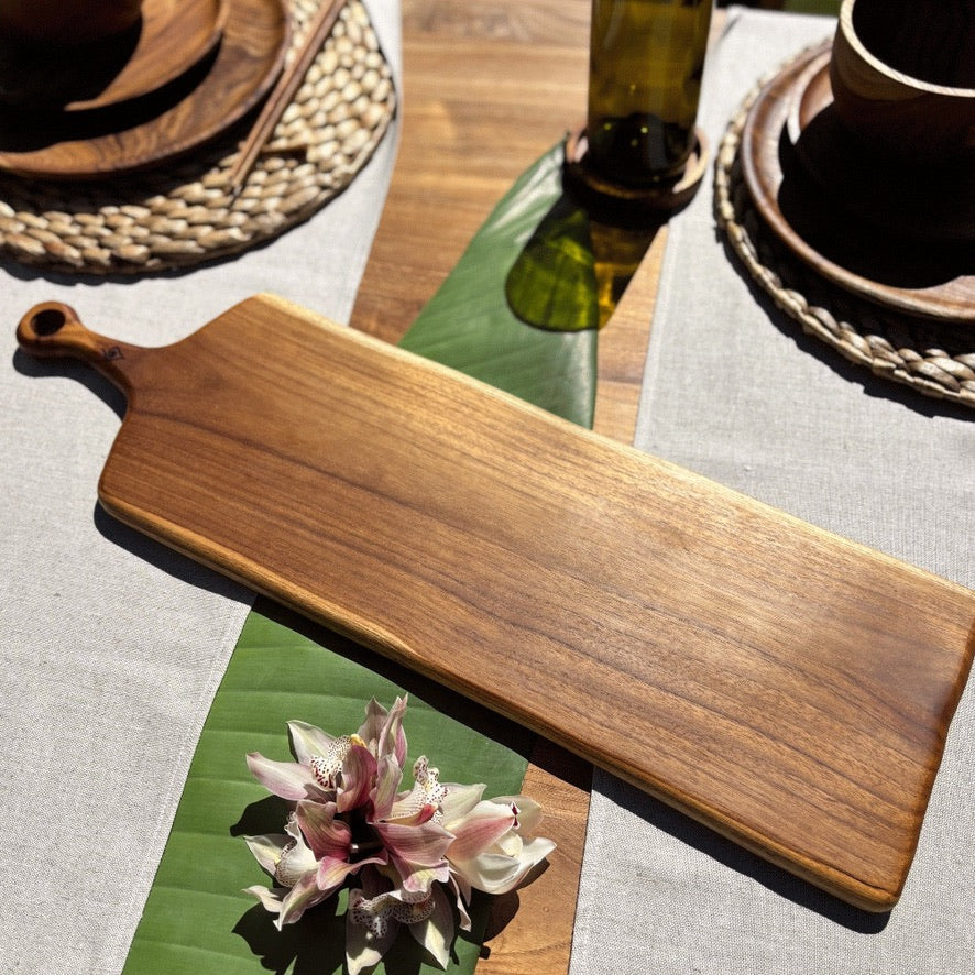 This durable sleek teak charcuterie board is a masterpiece and is designed for serving bold, adventurous spreads. 
60cm x 18cm x 1.5cm