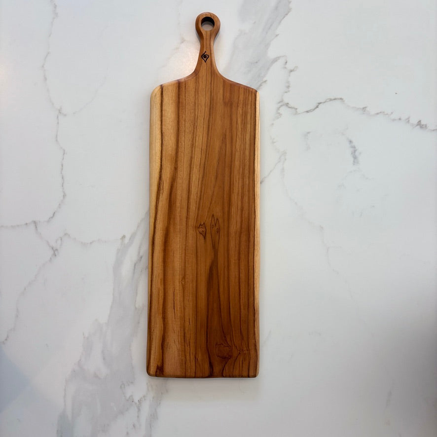 This durable sleek teak charcuterie board is a masterpiece and is designed for serving bold, adventurous spreads. 
60cm x 18cm x 1.5cm