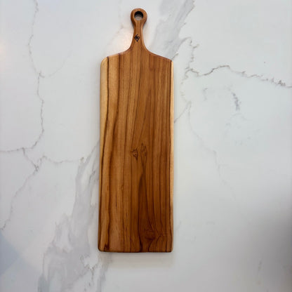 This durable sleek teak charcuterie board is a masterpiece and is designed for serving bold, adventurous spreads. 
60cm x 18cm x 1.5cm