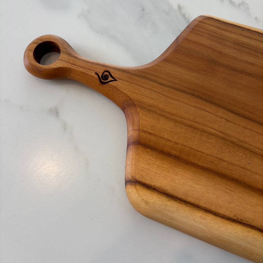 This durable sleek teak charcuterie board is a masterpiece and is designed for serving bold, adventurous spreads. 
60cm x 18cm x 1.5cm