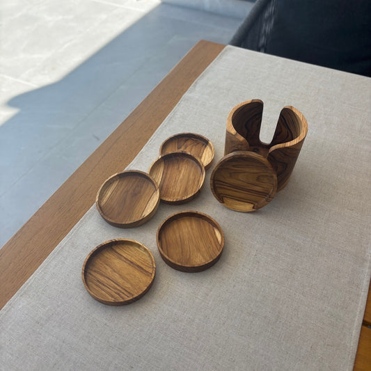 Handcrafted from sustainable teak root, each coaster in this set of 6 is a unique slice of nature, designed to catch drips and spills.
Coaster: 10cm x 1.5cm
Holder: 12cm x 10.5cm