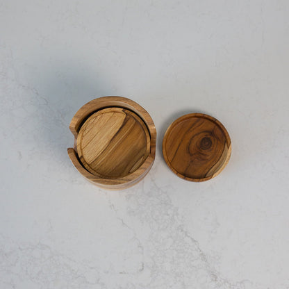 A round teak wooden coaster set with a natural wood grain pattern, shown from a top-down view on a marble bench
Coaster: 10cm x 1.5cm
Holder: 12cm x 10.5cm