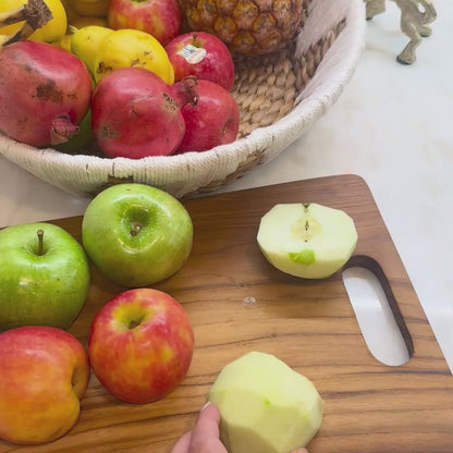 Video showing set of 2 teak chopping boards and teak utensils vs competitor wood fibre board, highlighting plastic-free materials, knife-friendliness, and natural sustainability.